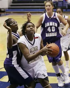 Jessica Adair drives to the basket past James Madison's Jennifer Brown during the first half.