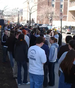 Fans wait in line outside The Charles E. Smith Athletic Center before a home basketball game