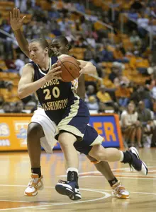 Kenan Cole (20) drives against Tennessee's Dominique Redding. (AP Photo)
