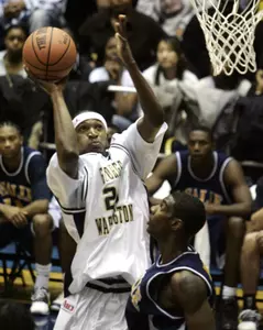 Regis Koundjia shoots over the La Salle defense during the first half.