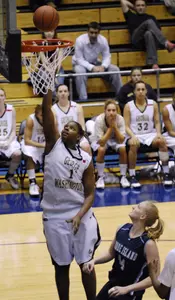 Jessica Adair (1) goes to the basket against Rhode Island's Erin Cournoyer (44). (AP Photo)
