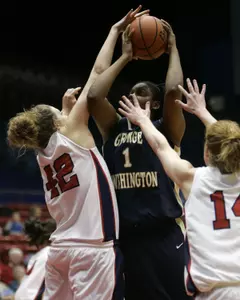 Jessica Adair (1) is fouled by Dayton center Nikki Oakland (42) (AP Photo)