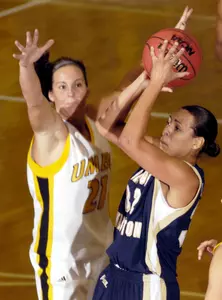 Sarah-Jo Lawrence, right, shoots over University of Maryland-Baltimore County's Michele Brokans during the first half. (AP/ Photo/Steve Ruark)