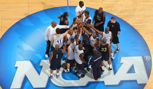 The Colonials gather on the ARCO Arena floor after Wednesday's practice.