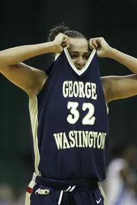 George Washington guard Sarah-Jo Lawrence (32) pulls her jersey over her face after fouling out in the second half. She led GW with 23 points.
