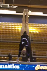 Christa Devine led the way on bars with a season high 9.85. The mark also ties her for eighth on GW's all-time list on the event.