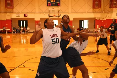 GW sophomore Jessica Adair (center) battles Ashley Paris for a rebound at the USA Basketball National Team Trials. Adair was named a finalist for the 2007 Pan American Games Team.