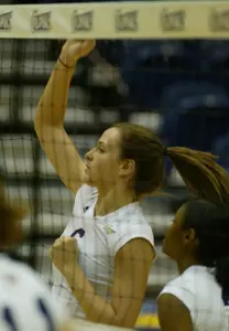 Katie Butz hit .303 with 13 kills and five blocks Saturday night at American.