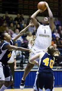 Jessica Adair shoots over two La Salle defenders during the first half of GW's 50-32 victory Wednesday night.