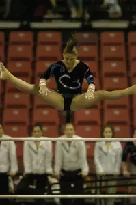 Christa Devine finished fourth on bars