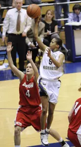George Washington's Kimberly Beck (5) puts up a shot over Dayton's Kiki Lund (4) during the second half (AP Photo)