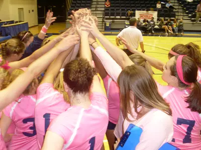 The Colonials wore pink uniforms to raise Breast Cancer Awarness.