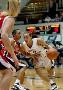 Sarah-Jo Lawrence, right, drives the ball past Richmond's Brittani Shells.