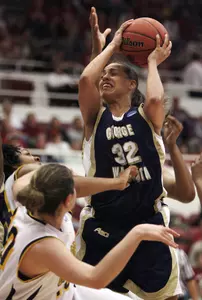 George Washington guard Sarah-Jo Lawrence drives to the basket California guard Lauren Greif during the first half (AP Photo)