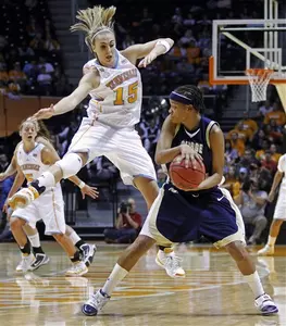 Redshirt freshman Brooke Wilson, who grabbed a team-high nine rebounds, passes around No. 6/5 Tennessee's Alicia Manning in a 93-53 loss Tuesday night.