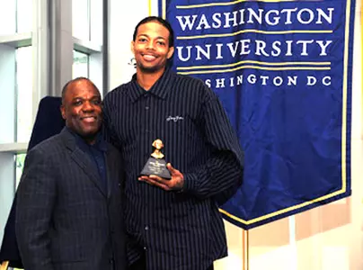 Coach Karl Hobbs presents Rob Diggs with the team MVP award for the second straight year at Monday's Senior Honors Luncheon.