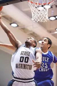 Dwayne Smith scores two of his game-high 16 points against Holy Cross on Friday.
