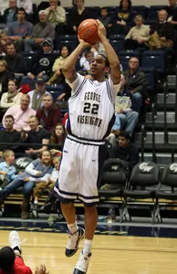 Damian Hollis poured in 16 first-half points to propel GW to a 19-6 lead to open Wednesday's game at Charlotte.
