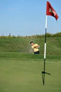 Martin Liu blasts out of a greenside bunker.