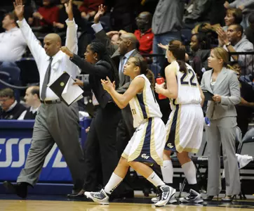 GW celebrates its 45-43 victory over Rutgers last season. The Colonials visit the RAC to battle the Scarlet Knights Monday at 7:30 pm.