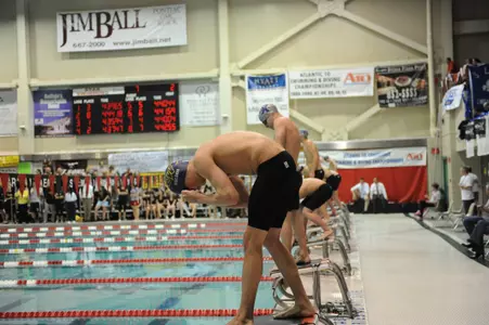 The George Washington men's swimming team was edged by UMBC, 138-112, Saturday afternoon.