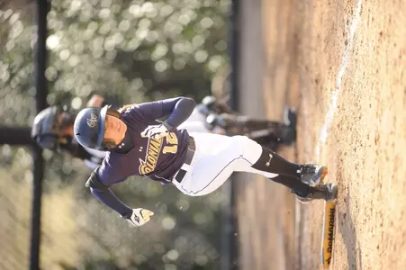 Sophomore Julie Orlandi manges her busy schedule between softball games and practices, NROTC and classes.