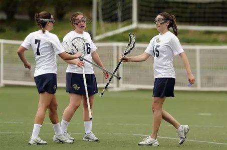 Junior Megan Siedman and sophomore Nicole Lacey (7) both recorded four-point outings as GW wrapped the 2011 season with an 18-10 loss to Richmond Friday.