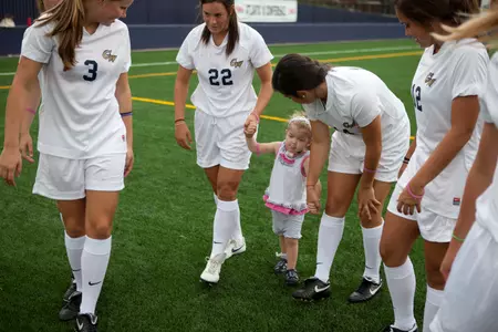 Members of the GW women's soccer team with Lily Noakes.