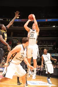 Sophomore Nemanja Mikic scored nine of his season-high 19 points during the final 5:40 to help lift GW past Charlotte, 60-52, on Saturday night.