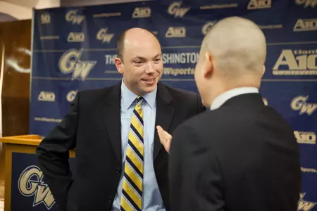 Jonathan Tsipis mingles with fans after he is introduced as the ninth head coach of George Washington women's basketball.
