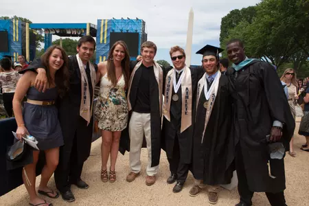 With the Washington Monument as their backdrop, members of the GW Baseball team joined 73 student-athletes at Commencement on the National Mall on Sunday.