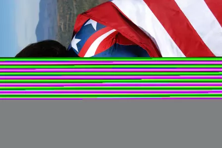 GW Softball Alumna Elana Meyers displays her Olympic bronze medal for bobsled.