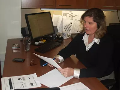 Associate Athletics Director Dr. Scarlett Schmidt leads GW's Athletics Development office and its efforts with the Buff and Blue Fund.