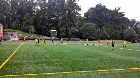 Players battle for the ball in a Buff and Blue scrimmage during preseason.