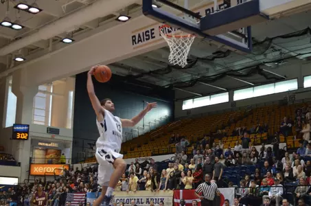 Junior Patricio Garino glides in for two of his game-high 16 points in GW men's basketball's 89-47 exhibition rout of Bloomsburg on Saturday.