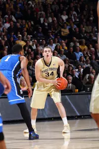Recent GW men's basketball transfer Tyler Cavanaugh, shown here being guarded by 2014 NBA Draft lottery pick Jabari Parker, netted a career-high 20 points in an upset of No. 4 Duke in March 2014.