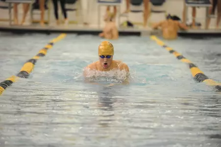 Senior Adam Rabe clinched two first-place finishes and a runner-up effort on Friday.