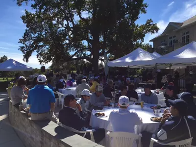 GW golfers enjoy lunch at an event with the SMGA