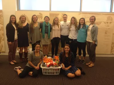 The GW Lacrosse team will collect Thanksgiving baskets as part of Colonial Harvest.