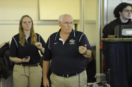 Head Coach Dan Rhinehart leads his Colonials to the Atlantic 10 Championships on Wednesday.