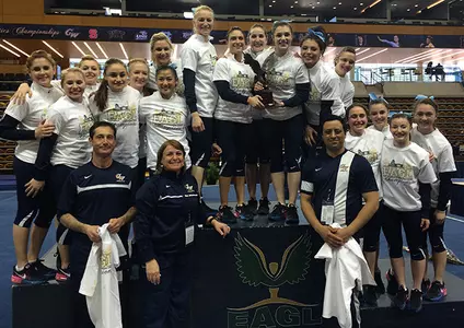 GW seniors hoist the EAGL Championship trophy on Sunday afternoon at the SECU Center in Towson, Maryland