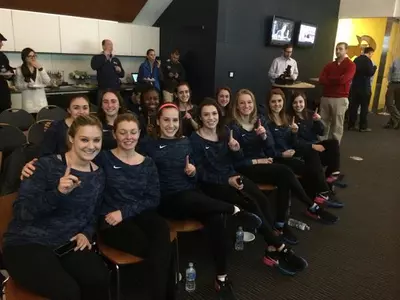 GW gymnasts celebrate after learning they will compete at the NCAA Auburn Regional on April 4.