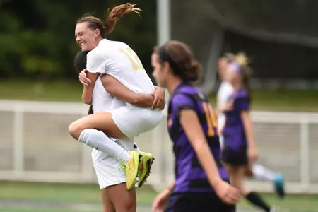 Junior MacKenzie Cowley celebrates one of her two goals against East Carolina on Sunday.