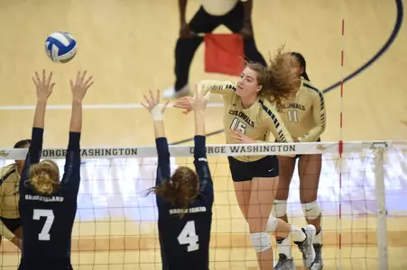 Women's Volleyball Attacking over the Net