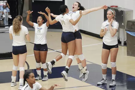 Women's Volleyball Celebrating on the sidelines