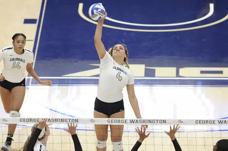 Volleyball attacking over the net