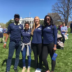 Tobi Adewole, Lauren Chase, Maggie Skjelbred and Chidima Osuchukwu on the South Lawn.