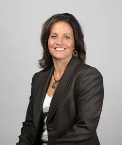 Jennifer Rizzotti becomes the 10th head coach in GW women's basketball history.