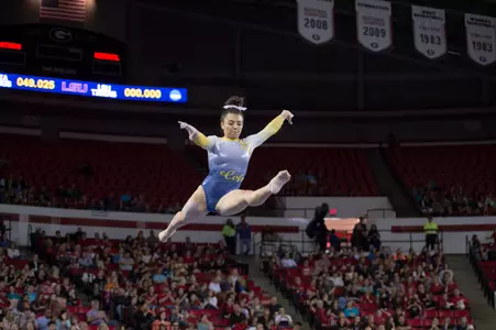 Junior Alex DeMoura performs on balance beam at the NCAA Athens Regional.