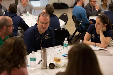 Men's basketball coach Mike Lonergan was among the attendees at the Mental Health symposium.